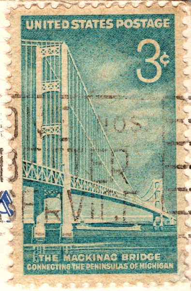 A 3-cent bright greenish blue Mackinac Bridge commemorative stamp on a postcard, from the Postcard Origins collection