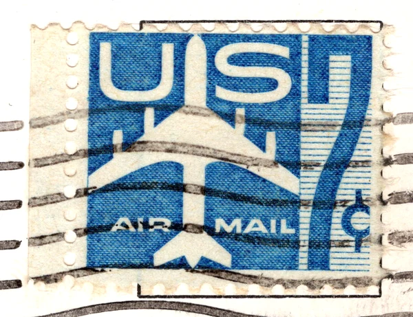 A 7-cent Silhouette of a Jet Airliner airmail stamp on a postcard, from the Postcard Origins collection